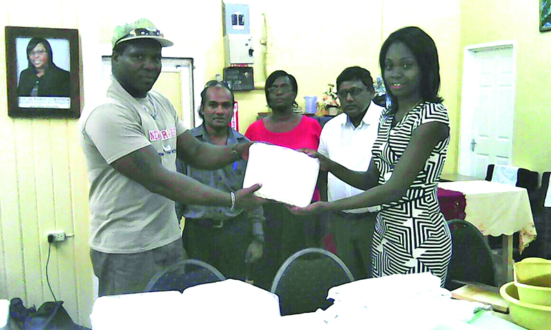 LHC PRO Shanteal Alleyne accepts the donation from Ondaan in the presence of CEO, Dr Riyasat and other LHC officials 