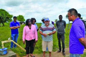 Minister within the Public Health Ministry, Dr Karen Cummings, along with Maruranau Toshao Patrick Gomes, being briefed by a GWI representative on the state of one of the wells in Maruranau 