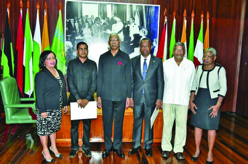 Members of the new Public Procurement Commission pose with President David Granger in October, shortly after their appointment 