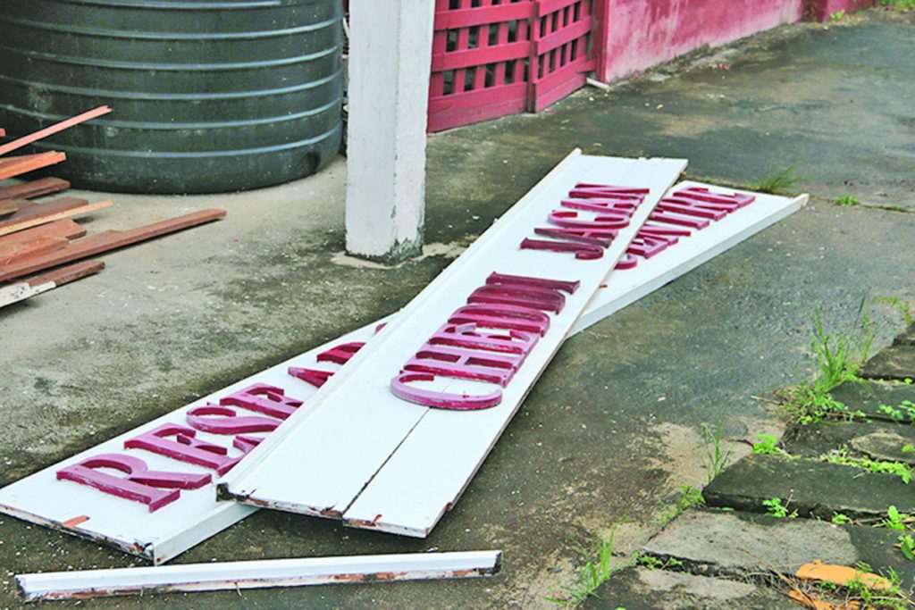 The Red House sign that was ripped down by Government officers 