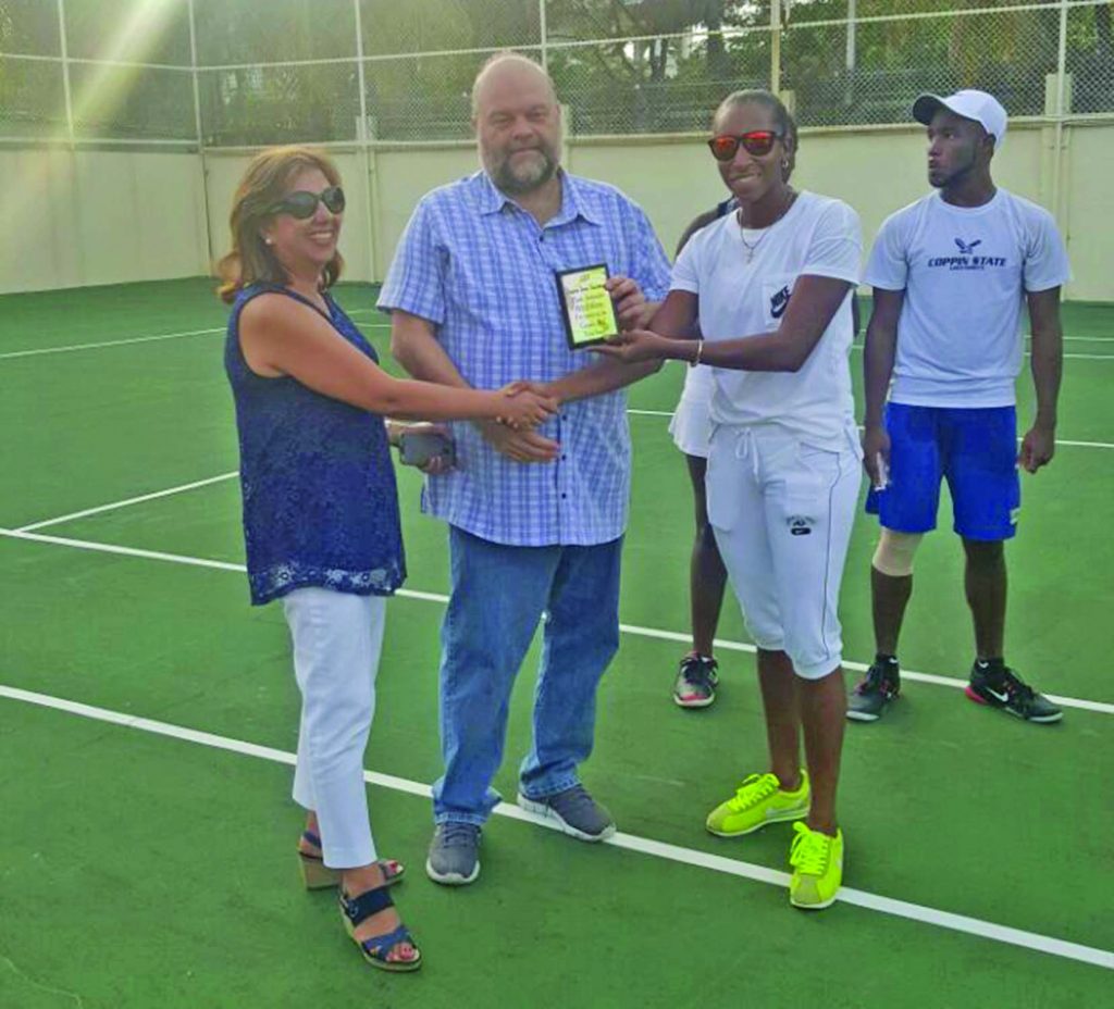 2016 female tennis player of the year, Cristi Campbell presents US Ambassador Perry Holloway with a plaque in the presence of wife Rosaura Holloway 