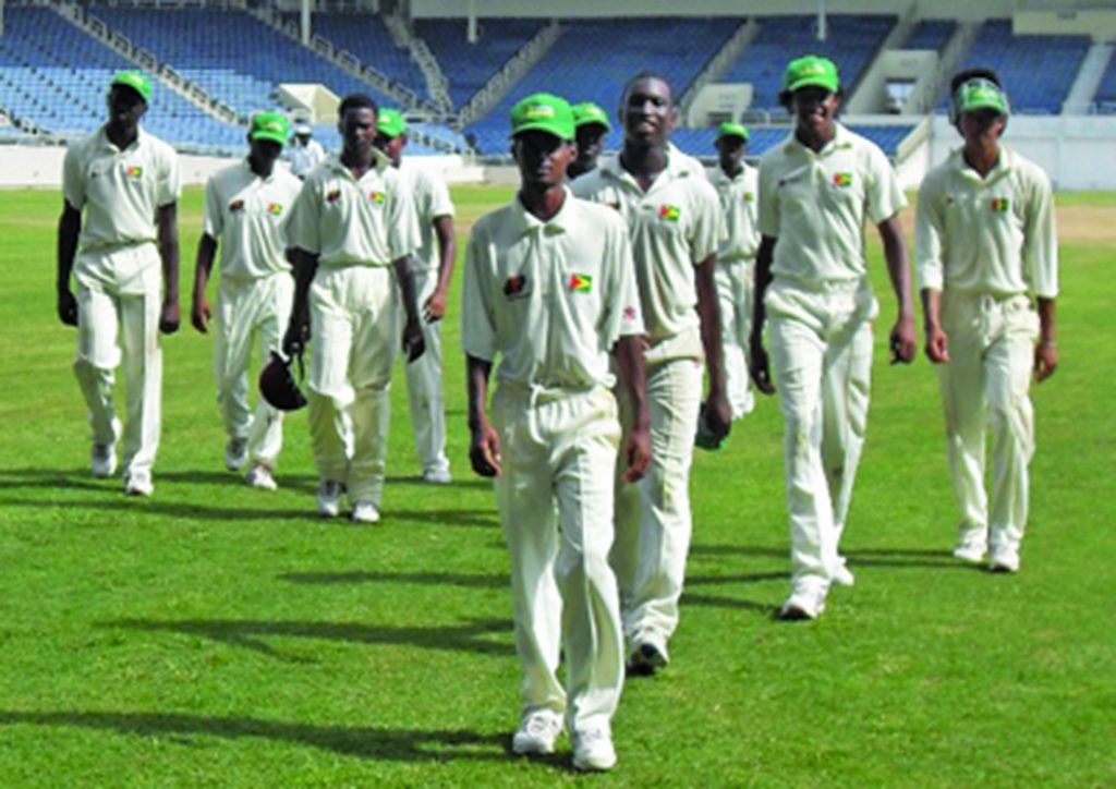 Totaram Bishun leads Guyana U-19 off the field after a career best 7-64 against Windward 2009