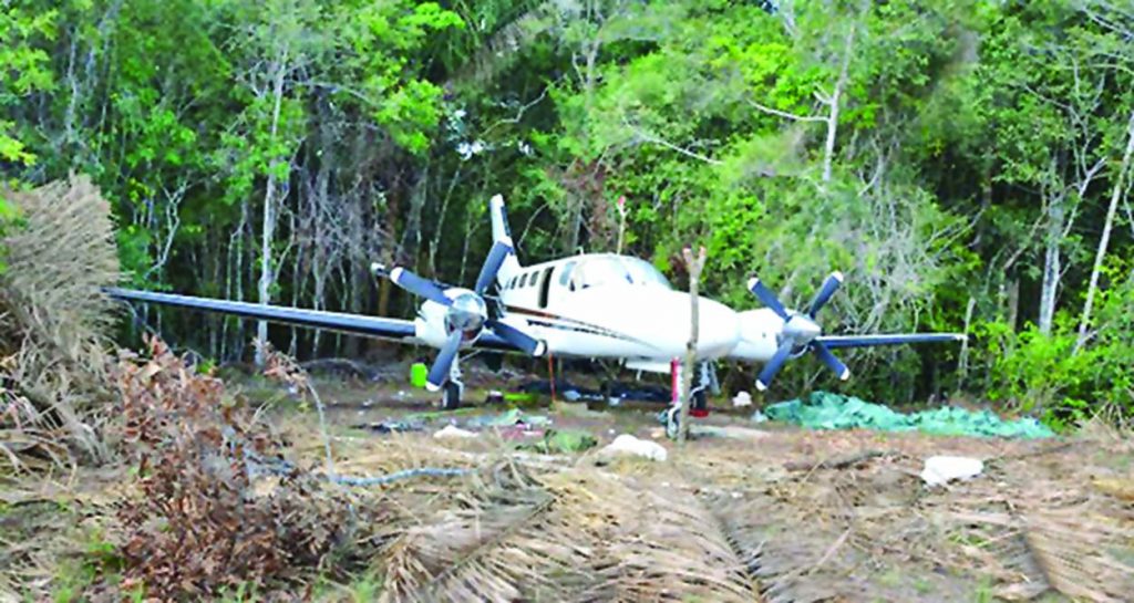 The partially hidden illegal aircraft found at Yupukari, Region Nine 