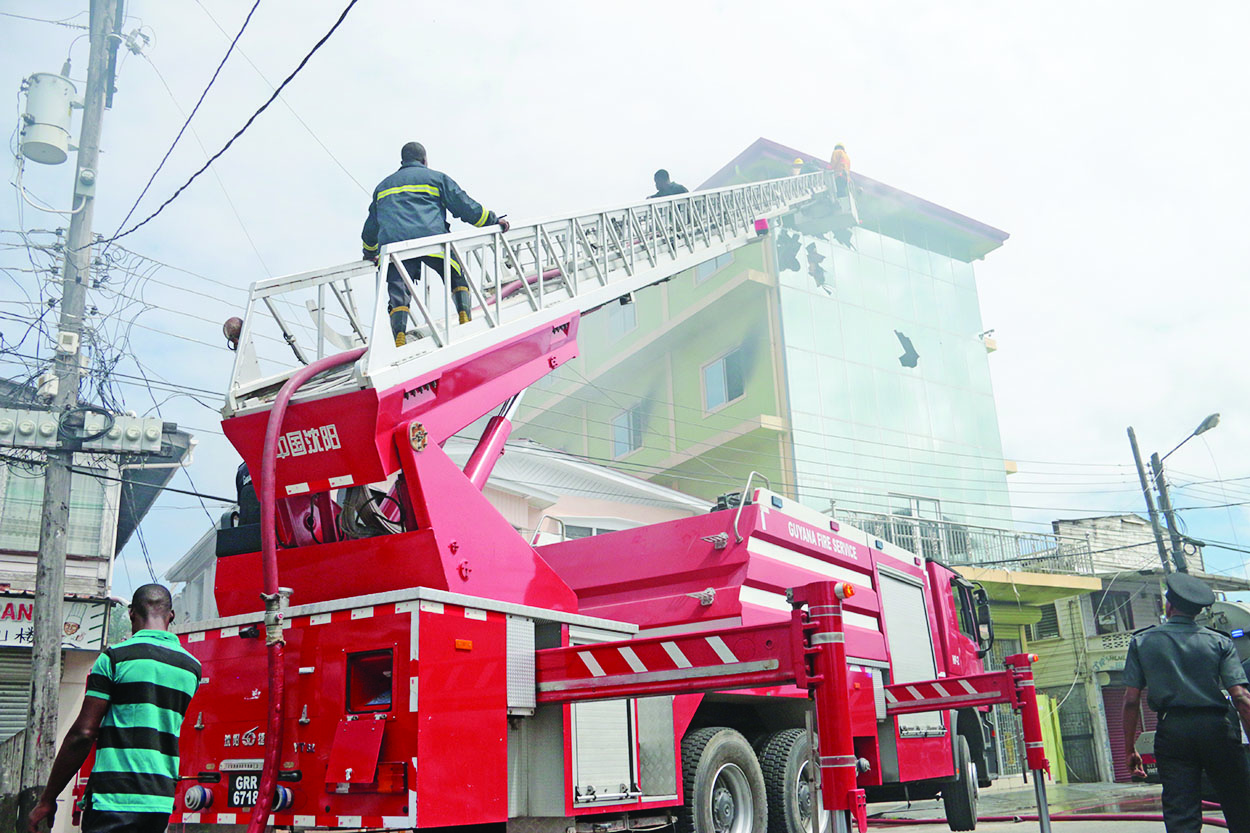 Fire destroys upper flat of Robb Street business Guyana Times