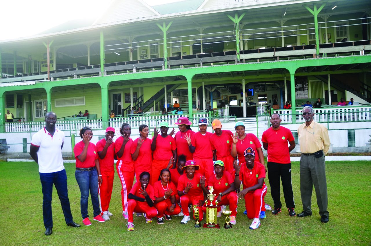 Victorious Berbice team pose with winning trophy. Coach Andre Percival is second from right standing along with GCB Officials Colin Europe (extreme left) and Rayon Griffith (right) 