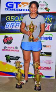 Trinidadian Bridget Singh with her trophies after emerging victorious in the 125cc senior category 