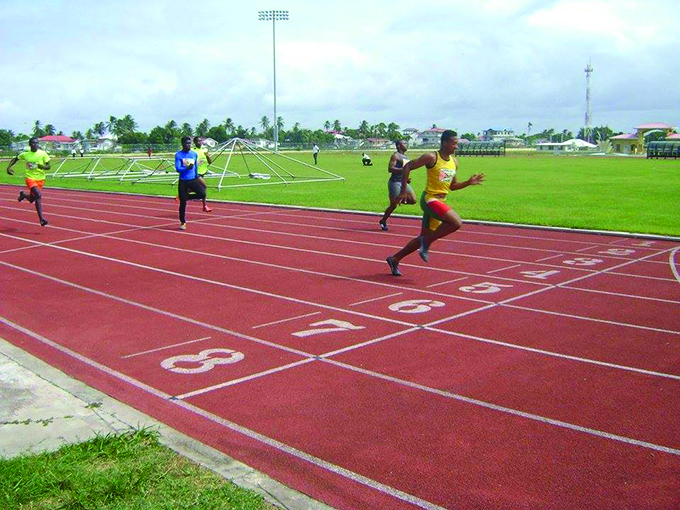 Compton Caesar winning the 100m 