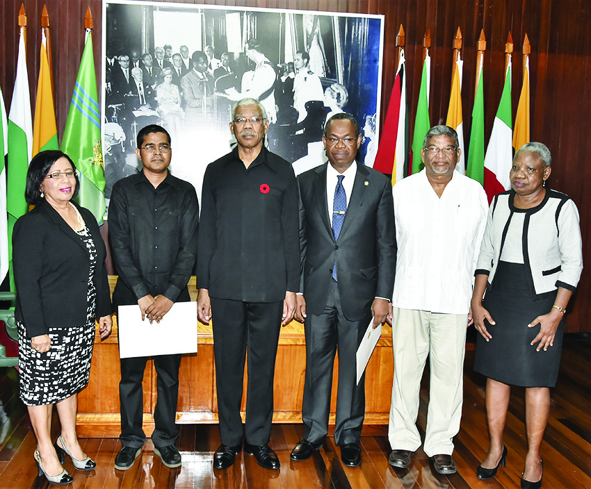  The Commissioners after they were sworn in last year; from left are Carol Corbin, Sukrishnalall Pasha, President David Granger, Ivor English, Nanda Gopaul and Emily Dodson 