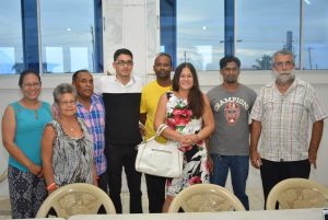 Phillip DeNobrega Jnr (black and white) is flanked by family members and GASA Executive at the National Aquatic Centre (Dexter Ceres photo) 