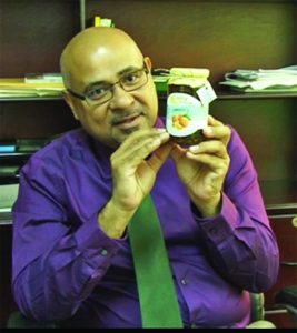 Director ofthe Institute for Applied Science and Technology (IAST) Dr. Suresh Narine displaying a sample of orange marmalade 
