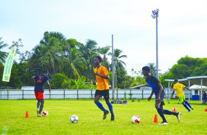 Under-17 players practicing dribbling drills on the opening day at the Tucville ground, Georgetown  