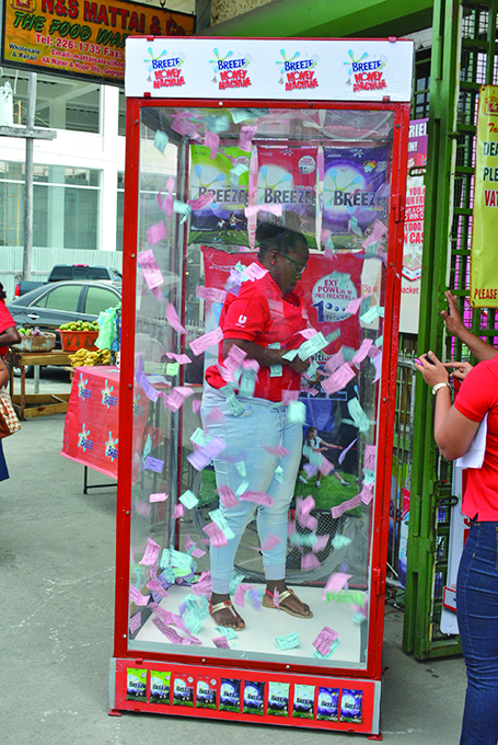 One of the winners grabbing what she could in the machine 