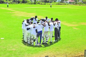 Mahaicony Seconday in a huddle before the start of the match