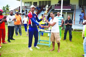 The tournament’s Most Valuable Player, Ramo Malone (left) is happy to receive his symbol of ‘a good day at the office’ 