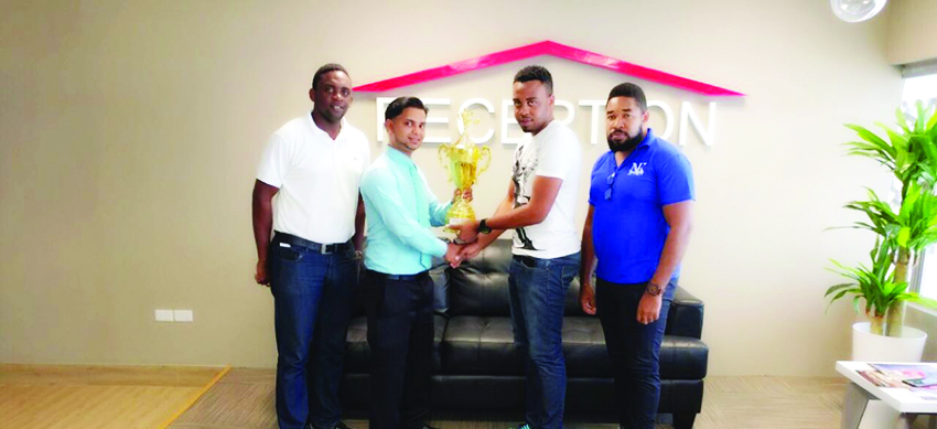 Organiser Shareef Major (2nd from right) accepts the sponsorship from Nalico Manager Vickash Persaud while Aubry Major Jr. and Kenrick Noel look on  