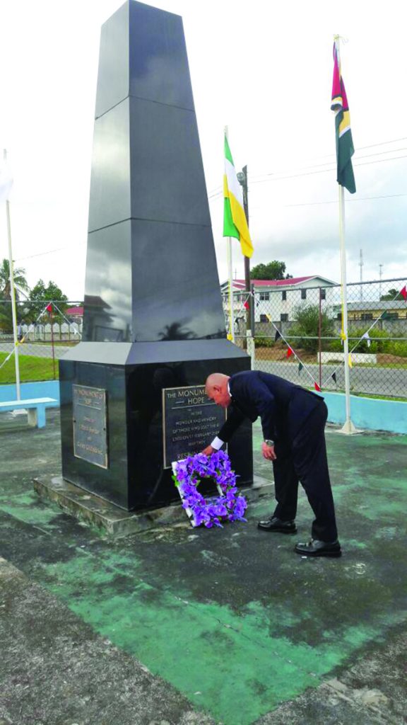 Minister Norton lays a wreath at the Monument of Hope which was erected in remembrance of the victims of the Bartica massacre 