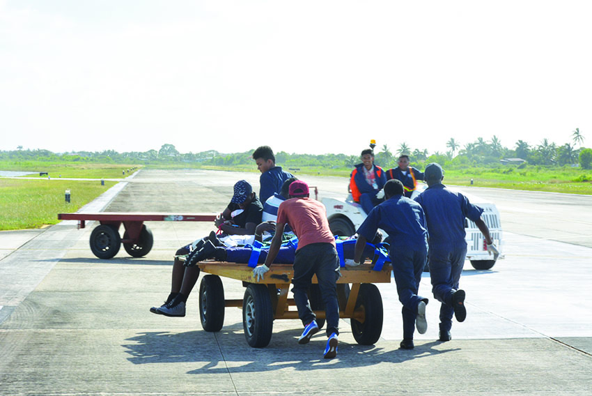 medical response team transporting the injured away from the accident scene