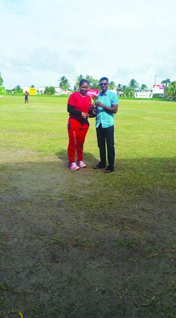 Player of the Match Melanie Henry receiving her award from former West Indies captain Shivnarine Chanderpaul at the Everest Cricket Club ground 