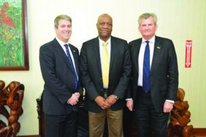 Minister of State Joseph Harmon and Russell Combe, Senior Security Sector Reform Advisor. 