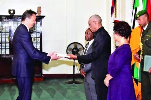 Swiss Ambassador Didier Chassot presenting his credentials to President David Granger on Wednesday at State House 