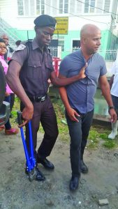 Businessman Timothy Tucker being assaulted by a City Constable (Newssource photo)  