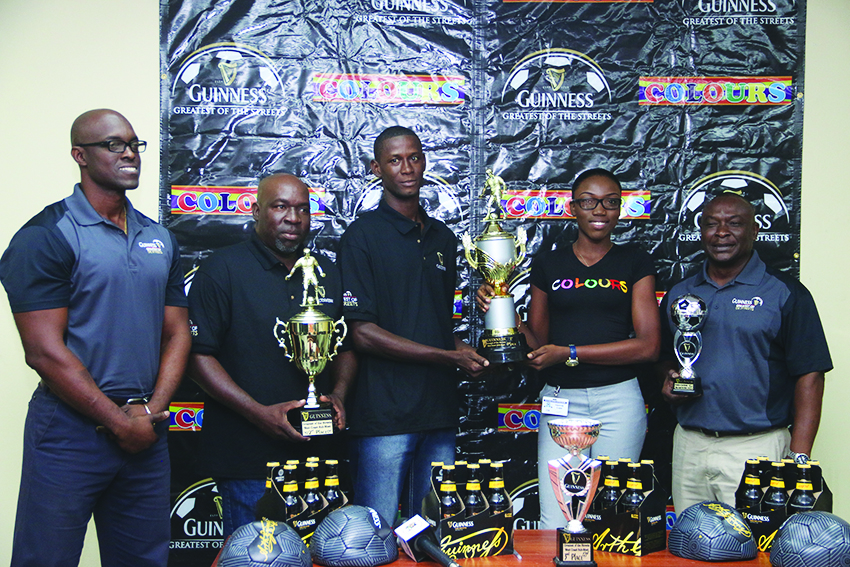 Co-ordinator Travis Bess and Colours Boutique representative, Creanna Damon hold the 1st place trophy while being flanked by Guinness Brand Manager Lee Baptiste (extreme left) and Banks DIH PRO Troy Peters (extreme right) at Thirst Park on Thursday