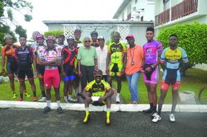 The winners take a photo op with the sponsors and organisers of the 26th R&R International 40-mile road race(Romario Samaroo photo) 