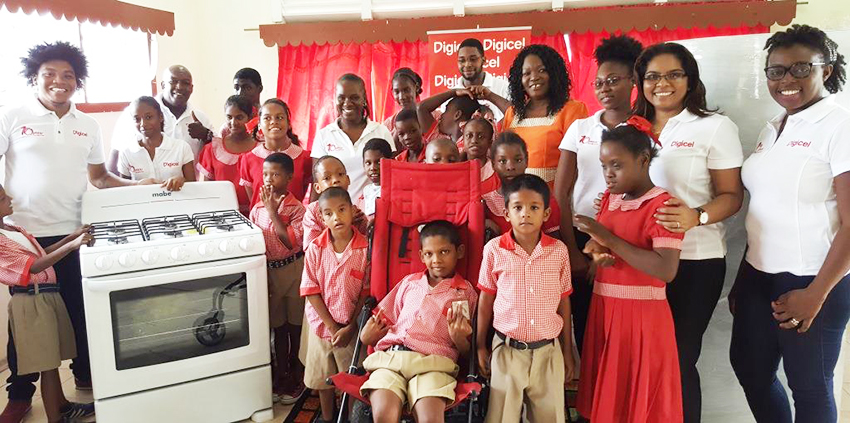 Students of the New Amsterdam Special Needs School posed with staff of Digicel Guy