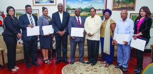 From left: Chief Executive Office of the GNBA Dr Prudence Lewis-Bhola; Joel Edmond; Aretha Nicola Campbell; Minister of State Joseph Harmon; GNBA Chairman Lieutenant Colonel Leslie Anthony Sobers; Prime Minister Moses Nagamootoo; Jocelyn Josiah; Dr Rovin Deodat; and Scheherazade  Ishoof-Khan 