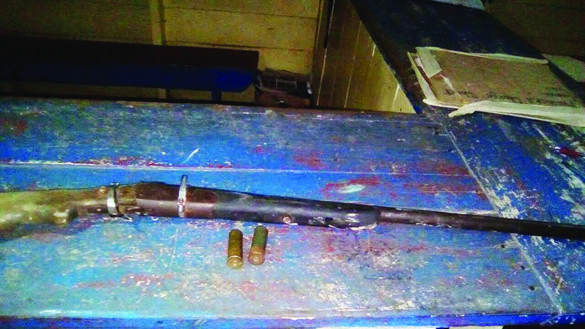 The unlicensed firearm and cartridges found on the two miners  