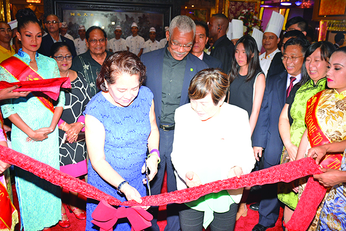 First Lady Sandra Granger cutting the ribbon in the presence of President David Granger, Chinese Ambassador to Guyana, Cui Jianchun, Mrs Cui Jianchun, Prime Minister Moses Nagamootoo and his wife Sita Nagamootoo  