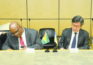  From left: Finance Minister Winston Jordan and IDB President Luis Alberto Moreno 