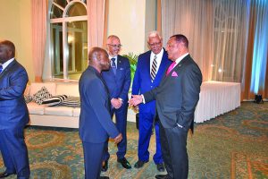 Foreign Affairs Minister Carl Greenidge, Agriculture Minister Noel Holder and Business Minister Dominic Gaskin sharing a light moment with Prime Minister Perry Christie of The Bahamas 