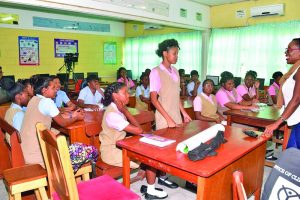 Office of Climate Change Communications Specialist Yasmin Bowman engaging students of the New Amsterdam Multilateral School on Friday  