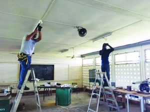 GEA technicians installing LED Lights at North Ruimveldt Multilateral  