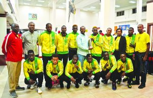GFF President Wayne Forde (center) along with the members of the National Beach soccer team 