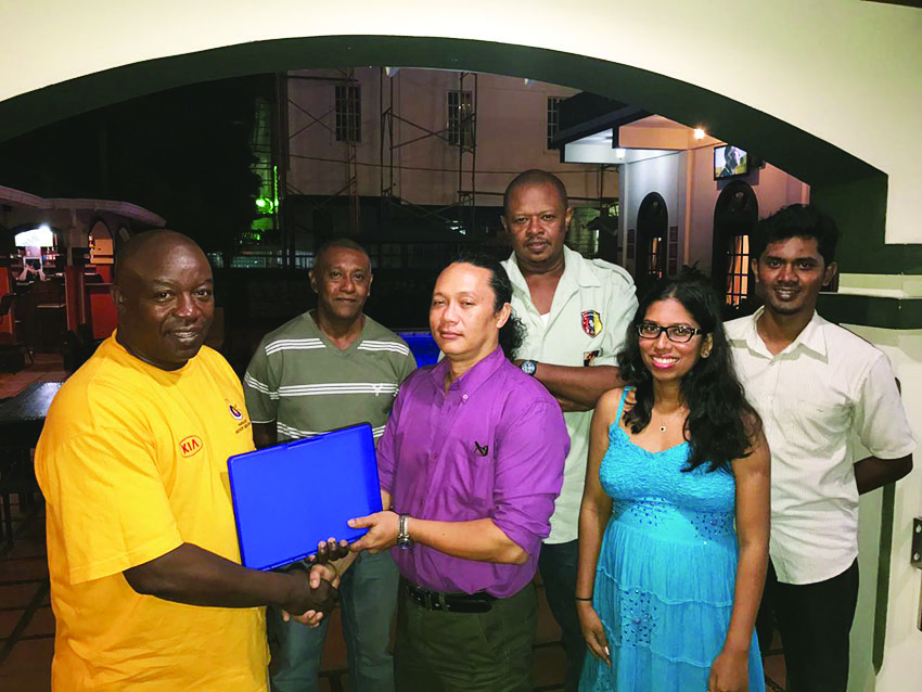 John Annel (left) handing over training materials to Chairman Nicholas Hing in the presence of President of GSSF, Vidushi Persaud-McKinnon, and Committee members Michael Abrams, Sean Duncan and Anand Mangra 