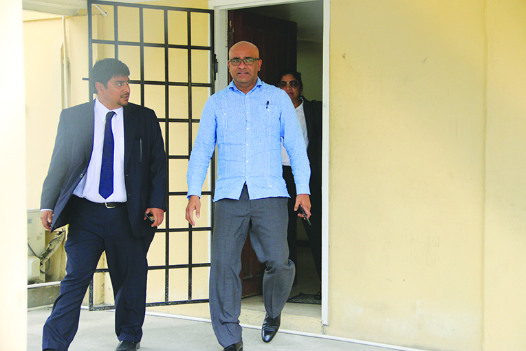 Former President and now Opposition Leader, Bharrat Jagdeo (right) leaving CID headquarters last Tuesday in the company of Attorney Sanjeev Datadin 