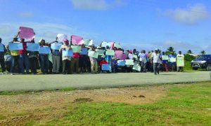 Rice farmers protesting the increases