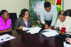 From left: Deputy Permanent Secretary Samantha Fedee, Minister within the Ministry Valerie Garrido-Lowe, a representative from Kalitech Inc Engineering Design and Supervisory Consultants and Indigenous Peoples’ Affairs Minister Sydney Allicock in discussion about the project 