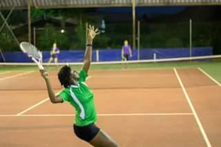 Nicola Ramdyhan serves during a doubles match at the Inter-Guiana Games 