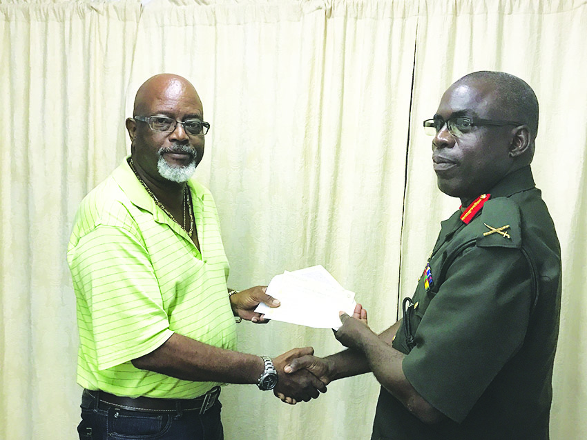 Harold Hopkinson (left) hands over the much needed sponsorship to Brigadier Patrick West at GDF Conference Room recently 