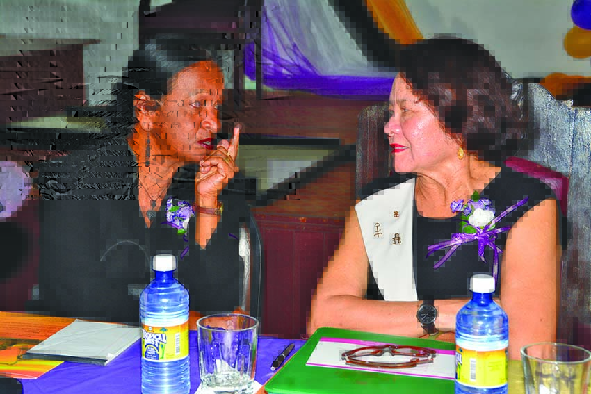 First Lady Sandra Granger in discussion with Chairperson of WGEC and parliamentarian, Indranie Chandarpal 