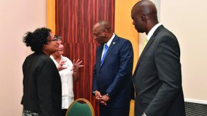 Minister of State, Joseph Harmon interacting with Guyana Lands and Surveys Commission Commissioner Trevor Benn, marine conservation activist Annette Arjoon-Martins and another participant