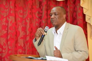 State Minister Joseph Harmon addressing Ministries’ staffers at the closing ceremony of the three-day retreat and workshop on Sunday