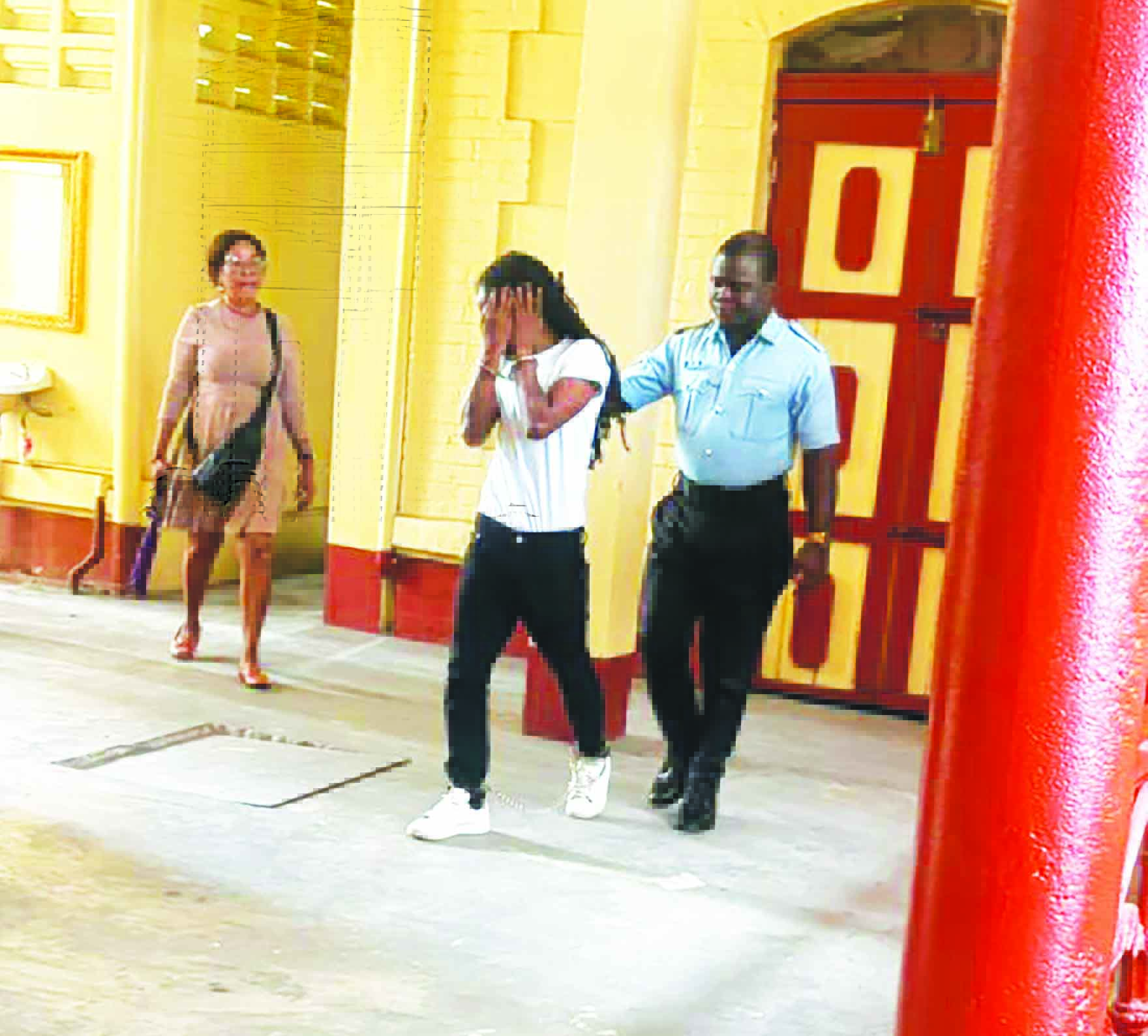 Crying vendor remanded on 2 counts of armed robbery - Guyana Times